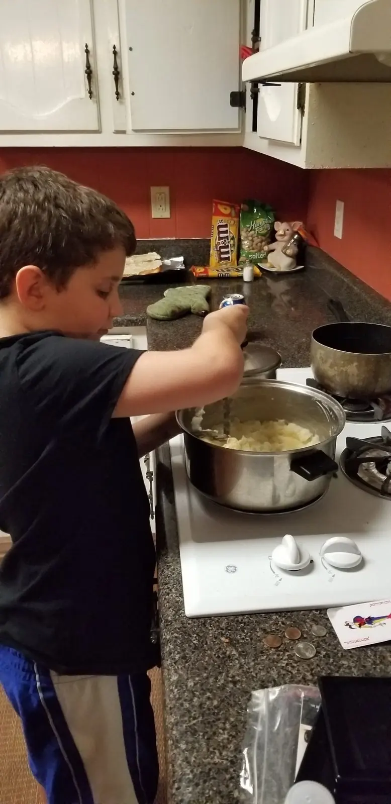 Chef Joe’s son cooking at the stove