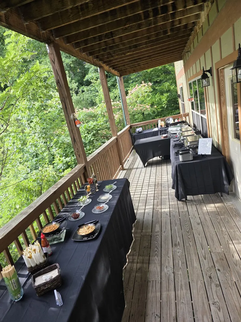 Hibachi buffet set up on a covered mountain deck before guests arrive