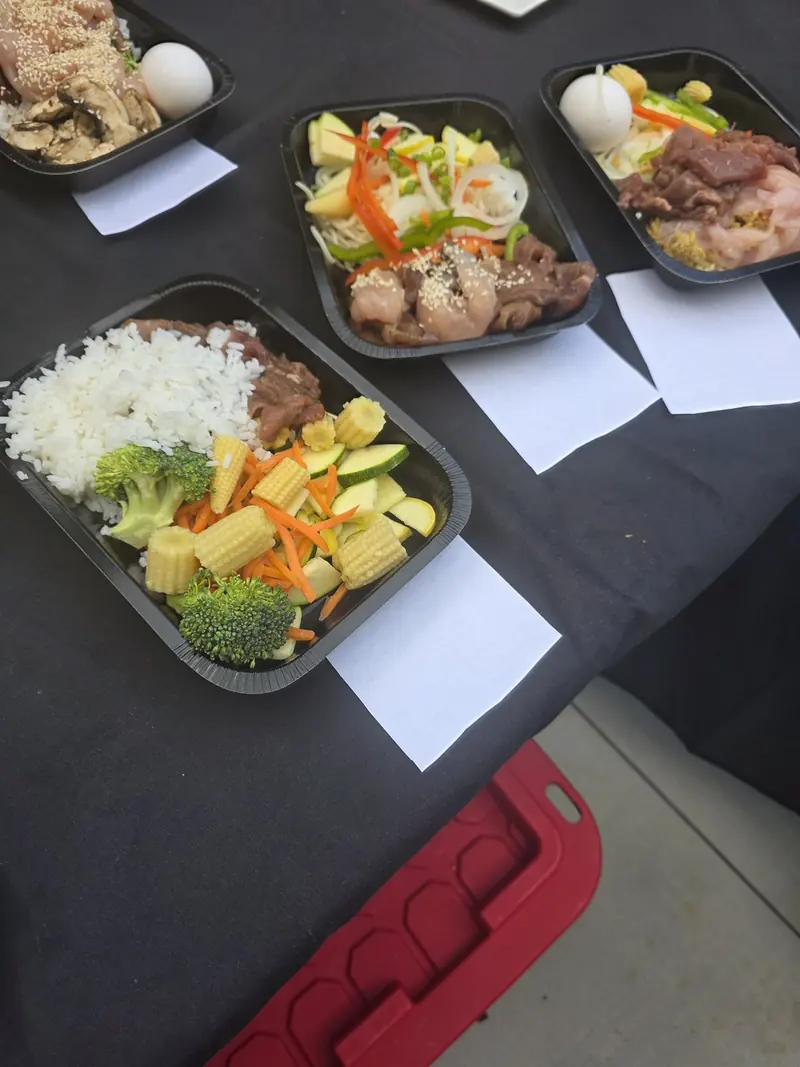 Hibachi meal prep trays portioned and ready for service