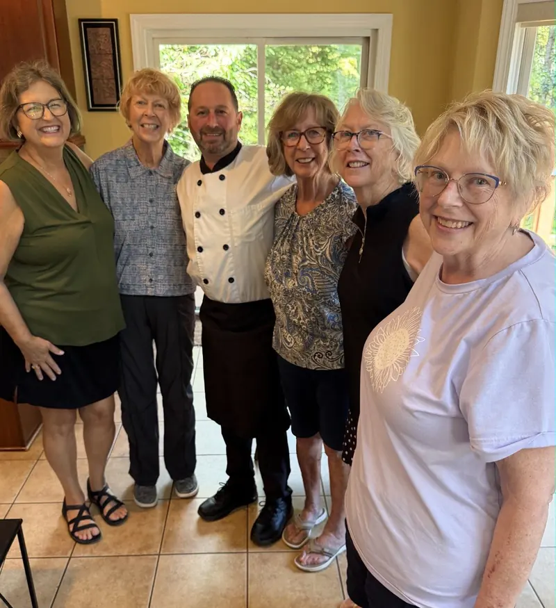 Chef Joe with a group of guests at a private event
