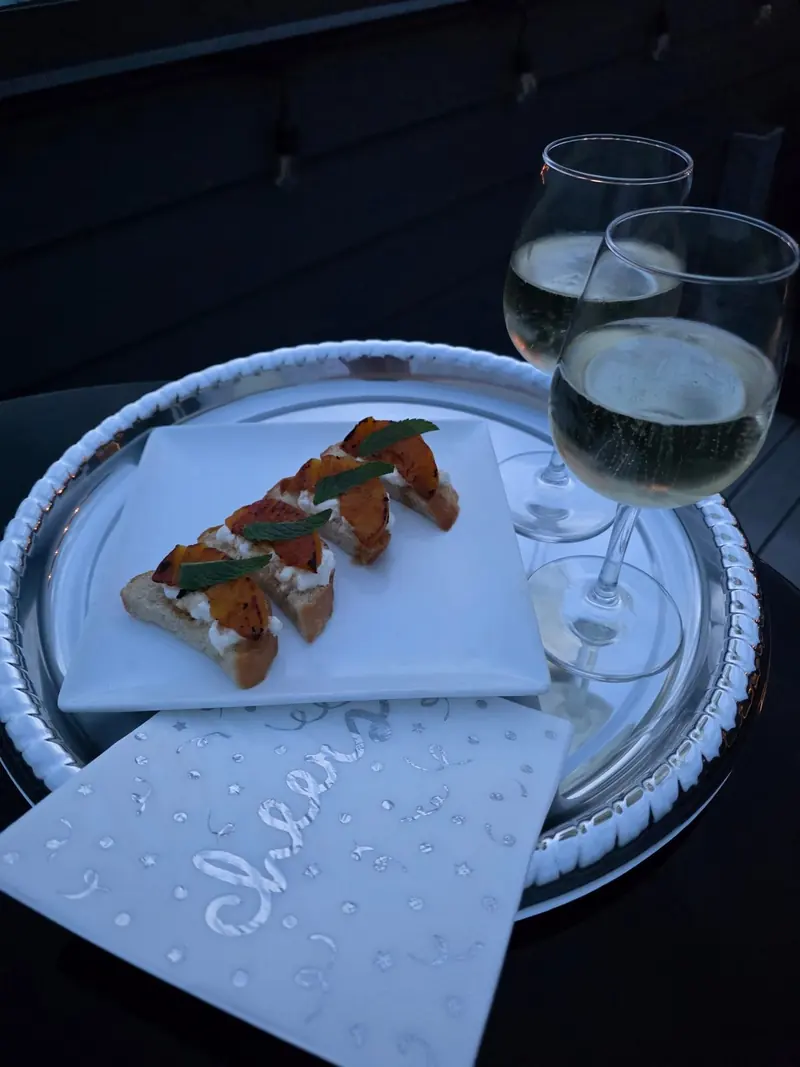 Passed bite served with champagne on the rooftop